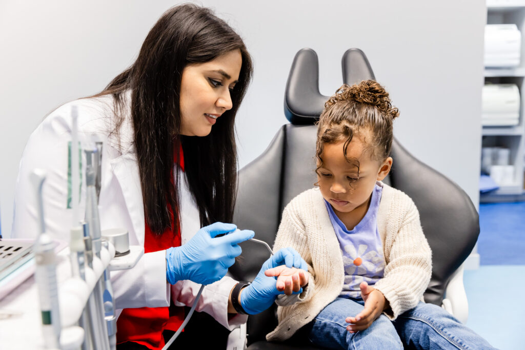dentist talking to a patient at our pediatric dentistry in Gainesville, VA